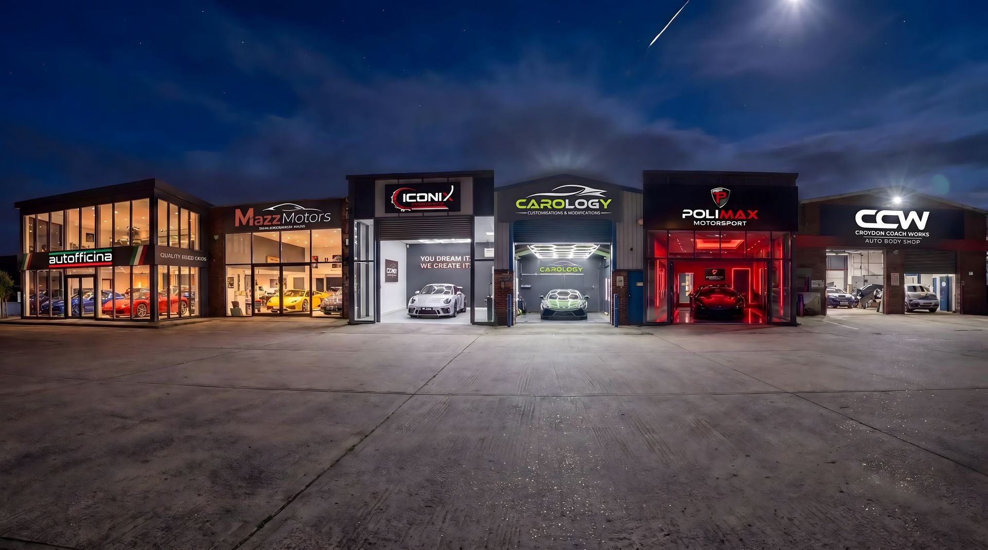 Six garage buildings lit up at night on a wet forecourt: Autofficina, Mazz Motors, Iconix, Carology, Polimax Motorsport and Croydon Coach Works